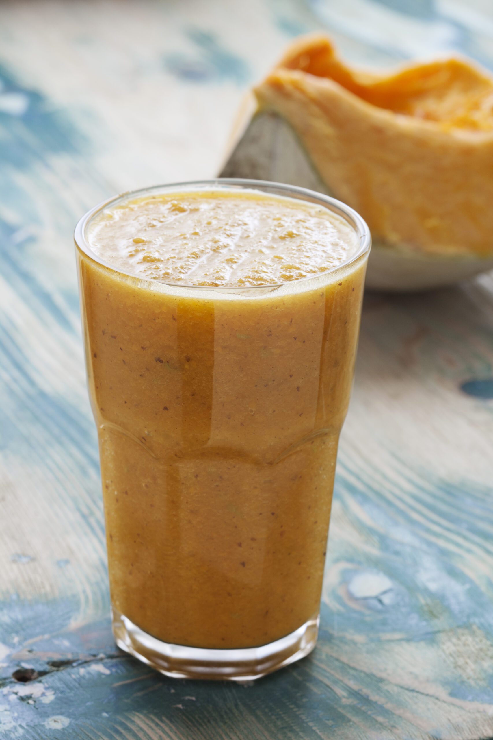 Pumpkin smoothie in a clear glass